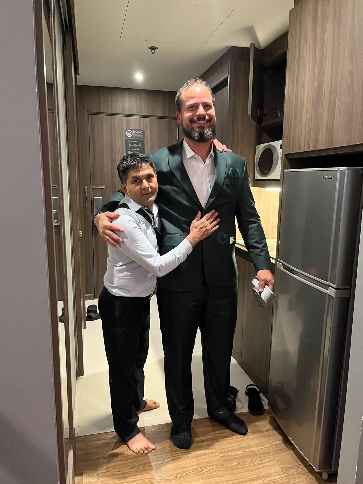 Happy client in custom tailored suit at King Fashion Uni Bangkok